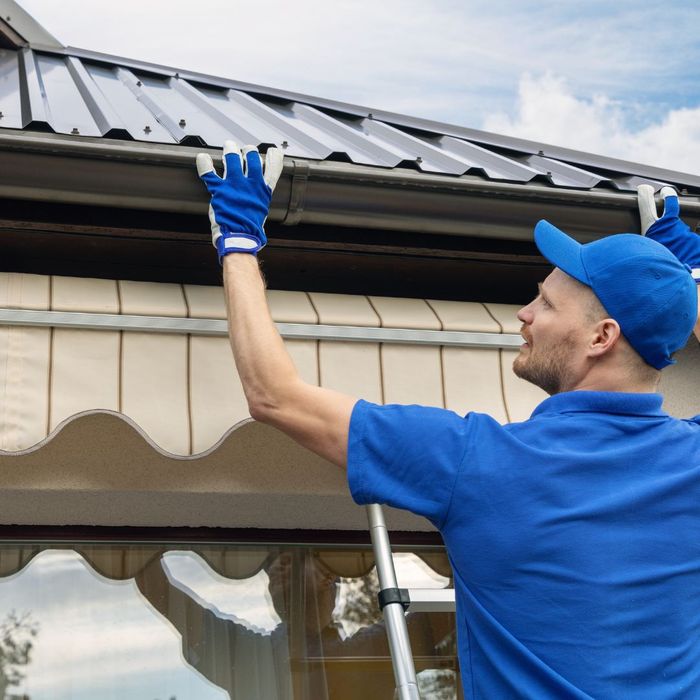 roofing contractor inspecting roof 